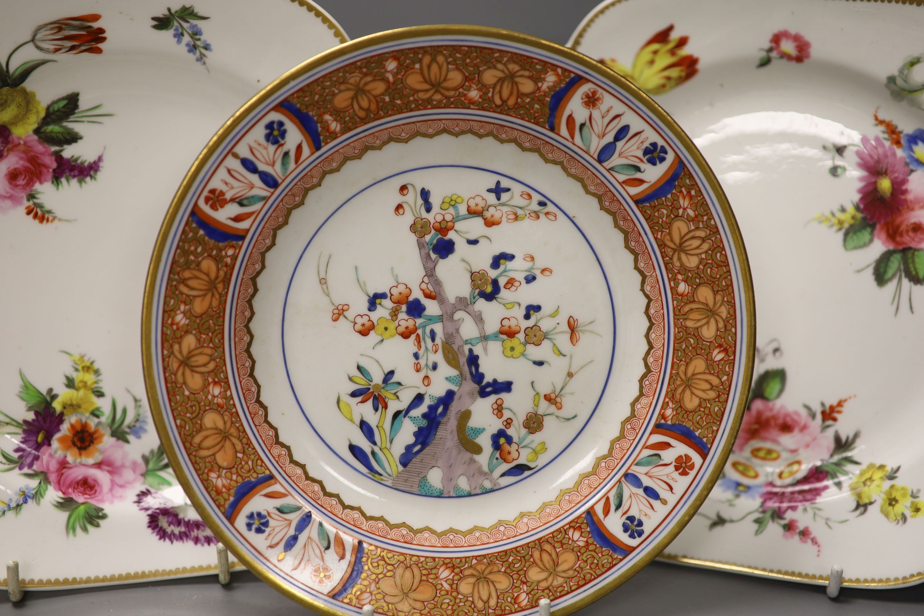 A set of three Spode square dishes each painted with three floral bouquets and three sprigs,